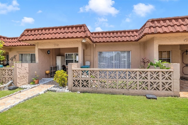 2316 SW 81st Way Unit 8, North Lauderdale, FL 33068 - view of front facade featuring stucco siding, a front yard, and a tiled roof