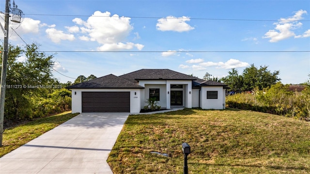 2709 58th St W, Lehigh Acres, FL 33971 - prairie-style house with concrete driveway, stucco siding, an attached garage, a front lawn, and a shingled roof