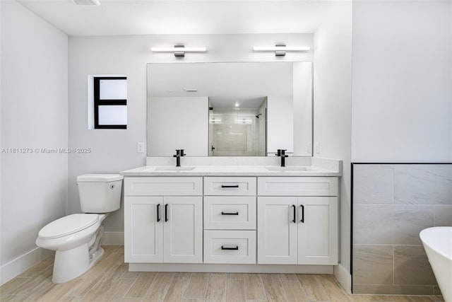2709 58th St W, Lehigh Acres, FL 33971 - full bath with a shower stall, double vanity, toilet, and wood finish floors