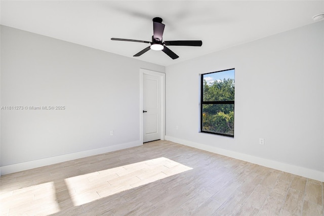 2709 58th St W, Lehigh Acres, FL 33971 - unfurnished room with light wood-type flooring, baseboards, and a ceiling fan
