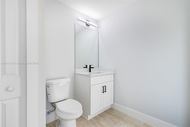2709 58th St W, Lehigh Acres, FL 33971 - bathroom with vanity, toilet, and baseboards