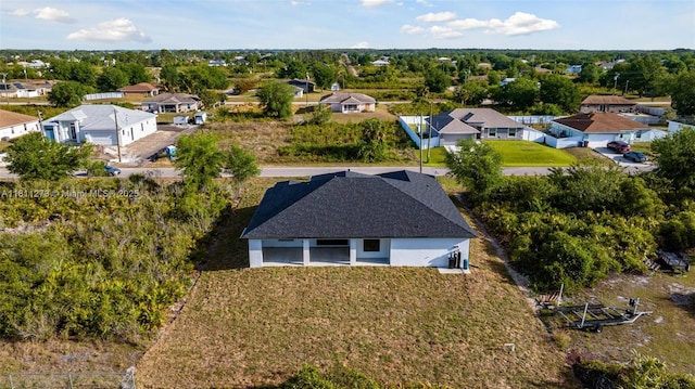 2709 58th St W, Lehigh Acres, FL 33971 - aerial perspective of suburban area with a tree filled landscape