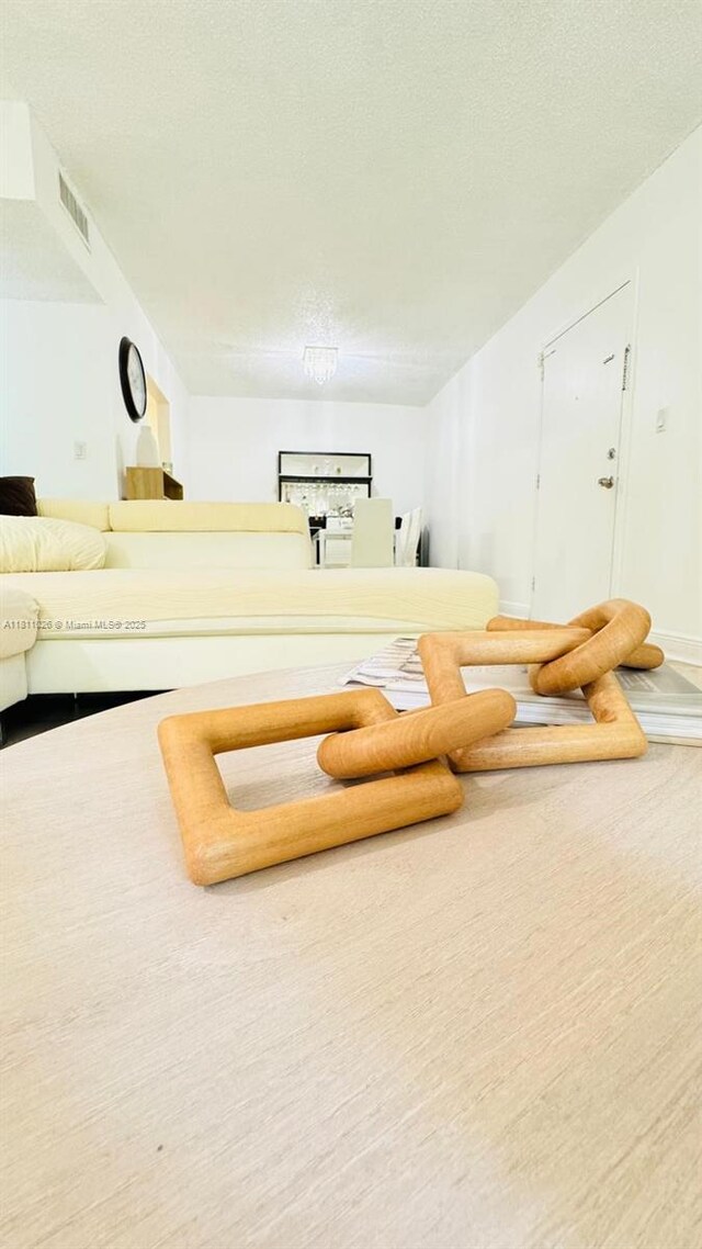 5122 NW 79th Ave Unit 301, Doral, FL 33166 - living room with a textured ceiling