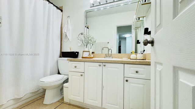 5122 NW 79th Ave Unit 301, Doral, FL 33166 - full bath with tile patterned floors, toilet, and vanity