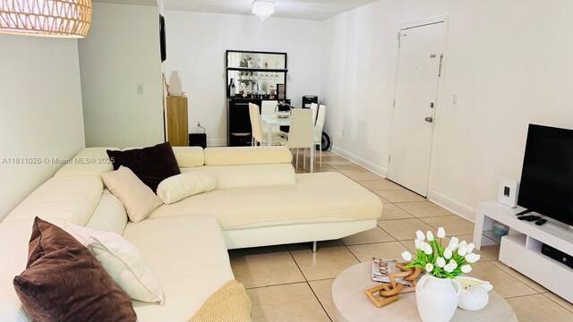 5122 NW 79th Ave Unit 301, Doral, FL 33166 - living room with light tile patterned floors