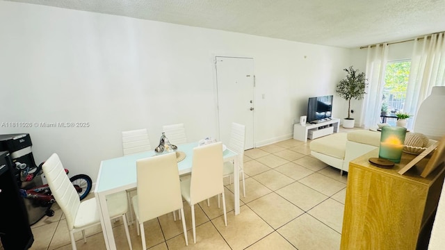 5122 NW 79th Ave Unit 301, Doral, FL 33166 - dining space with a textured ceiling and light tile patterned floors