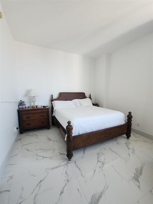 325 S Biscayne Blvd Unit 14, Miami, FL 33131 - bedroom with marble look tile flooring and baseboards
