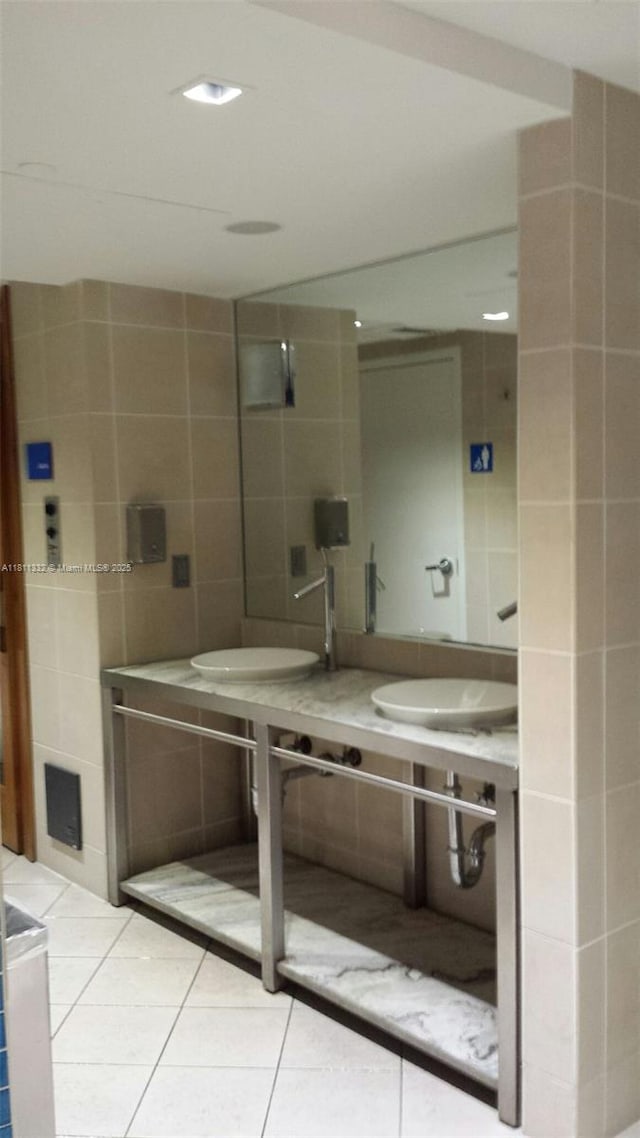 325 S Biscayne Blvd Unit 14, Miami, FL 33131 - bathroom featuring tile walls, a sink, and tile patterned floors