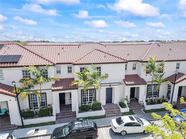 9471 SW 171st Pl, Miami, FL 33196 - view of front of property featuring a tiled roof, stucco siding, and uncovered parking