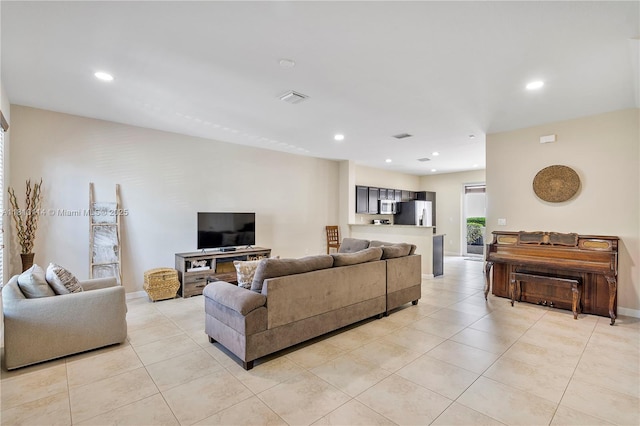 9471 SW 171st Pl, Miami, FL 33196 - living area featuring light tile patterned floors, recessed lighting, and baseboards