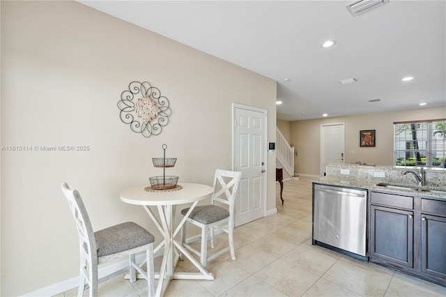 9471 SW 171st Pl, Miami, FL 33196 - kitchen featuring dishwasher, a sink, recessed lighting, light stone countertops, and baseboards