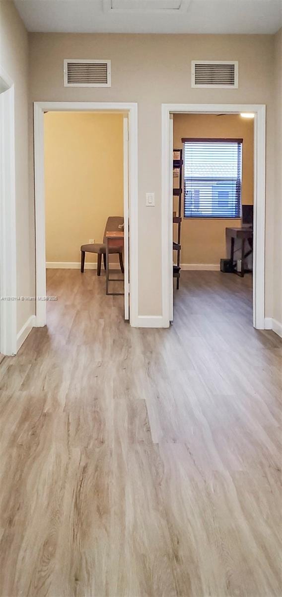 9471 SW 171st Pl, Miami, FL 33196 - hall with baseboards, wood finished floors, and attic access