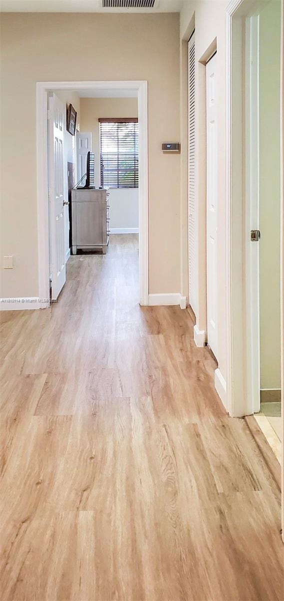 9471 SW 171st Pl, Miami, FL 33196 - hallway featuring baseboards and wood finished floors