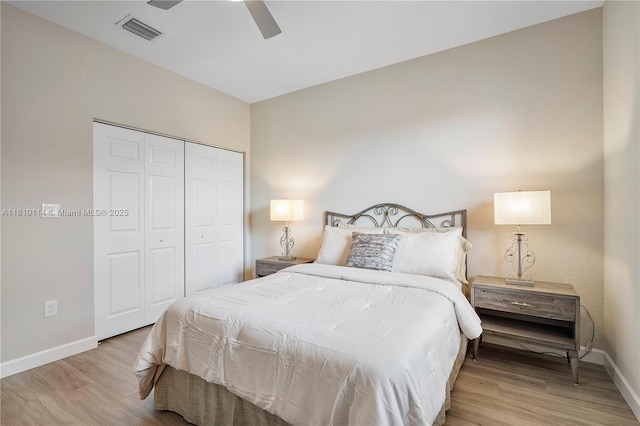 9471 SW 171st Pl, Miami, FL 33196 - bedroom featuring baseboards, wood finished floors, a closet, and a ceiling fan