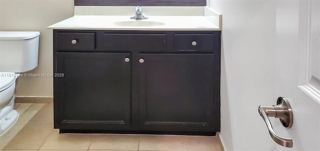 9471 SW 171st Pl, Miami, FL 33196 - bathroom with toilet, vanity, baseboards, and tile patterned floors