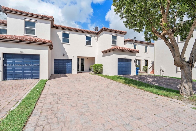 9471 SW 171st Pl, Miami, FL 33196 - mediterranean / spanish-style house with driveway, stucco siding, a tiled roof, and a garage