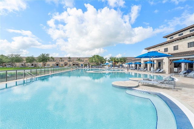 9471 SW 171st Pl, Miami, FL 33196 - community pool featuring a patio