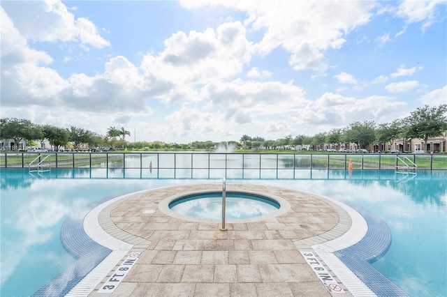 9471 SW 171st Pl, Miami, FL 33196 - view of swimming pool with a water view and a hot tub