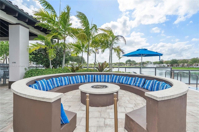 9471 SW 171st Pl, Miami, FL 33196 - view of swimming pool with an outdoor fire pit, a patio area, and a water view