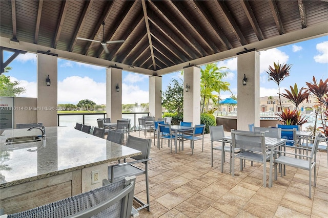 9471 SW 171st Pl, Miami, FL 33196 - view of patio / terrace with outdoor dining space, a water view, and an outdoor bar