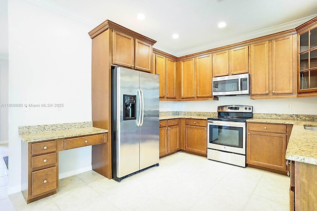 4631 Mediterranean Cir, Palm Beach Gardens, FL 33418 - kitchen with stainless steel appliances, brown cabinetry, crown molding, light stone countertops, and glass insert cabinets
