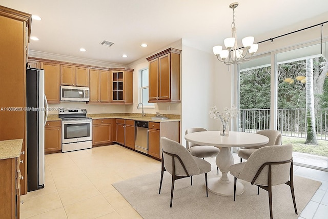 4631 Mediterranean Cir, Palm Beach Gardens, FL 33418 - kitchen with appliances with stainless steel finishes, light tile patterned flooring, a chandelier, brown cabinets, and glass insert cabinets