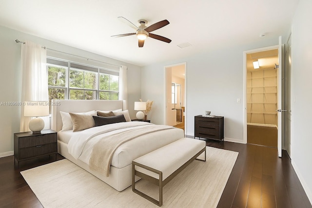 4631 Mediterranean Cir, Palm Beach Gardens, FL 33418 - bedroom with dark wood-type flooring, a ceiling fan, and ensuite bathroom