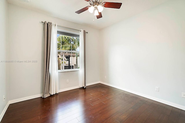 4631 Mediterranean Cir, Palm Beach Gardens, FL 33418 - spare room with dark wood-style flooring, ceiling fan, and baseboards