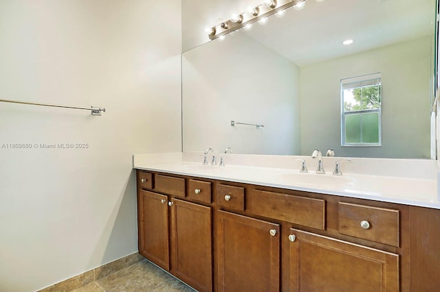 4631 Mediterranean Cir, Palm Beach Gardens, FL 33418 - bathroom featuring double vanity and baseboards
