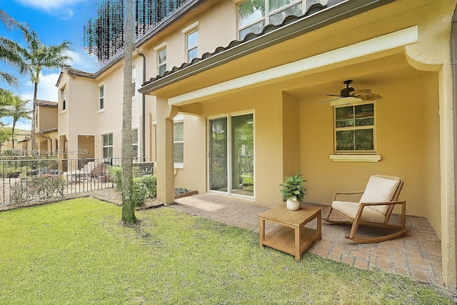 4631 Mediterranean Cir, Palm Beach Gardens, FL 33418 - back of house featuring stucco siding, a ceiling fan, and a patio