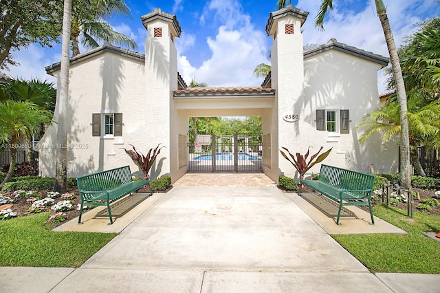 4631 Mediterranean Cir, Palm Beach Gardens, FL 33418 - view of property's community featuring a swimming pool and a patio area
