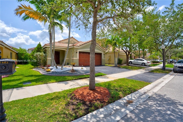 1482 Canary Island Dr, Weston, FL 33327 - mediterranean / spanish-style home with stucco siding, driveway, a garage, a front lawn, and a tiled roof