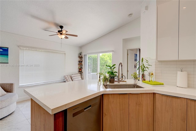 1482 Canary Island Dr, Weston, FL 33327 - kitchen featuring dishwasher, vaulted ceiling, light countertops, a peninsula, and a ceiling fan
