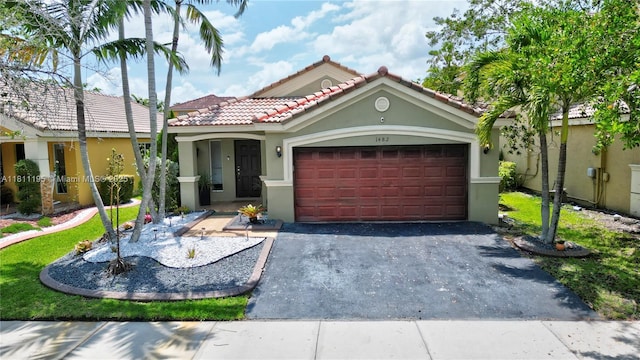 1482 Canary Island Dr, Weston, FL 33327 - view of front of property featuring stucco siding, driveway, an attached garage, and a tile roof