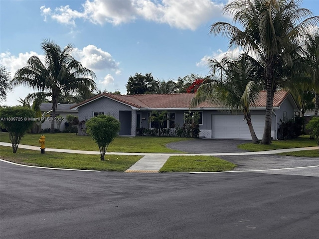 4888 NW 8th Ct, Plantation, FL 33317 - single story home featuring a tiled roof, a garage, and a front lawn