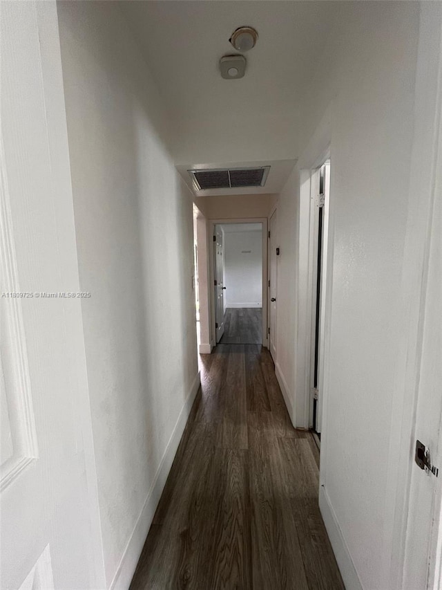 4888 NW 8th Ct, Plantation, FL 33317 - hallway with dark wood-style floors, attic access, and baseboards