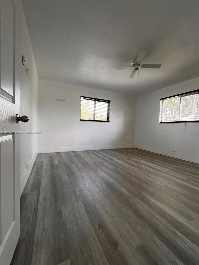 4888 NW 8th Ct, Plantation, FL 33317 - unfurnished room featuring dark wood-style flooring, a ceiling fan, and baseboards