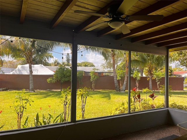 4888 NW 8th Ct, Plantation, FL 33317 - unfurnished sunroom with beamed ceiling and a ceiling fan