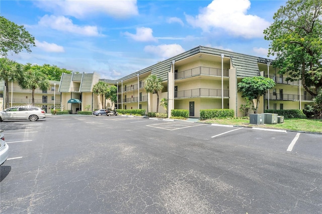 9091 Lime Bay Blvd Unit 110, Tamarac, FL 33321 - view of building exterior featuring uncovered parking