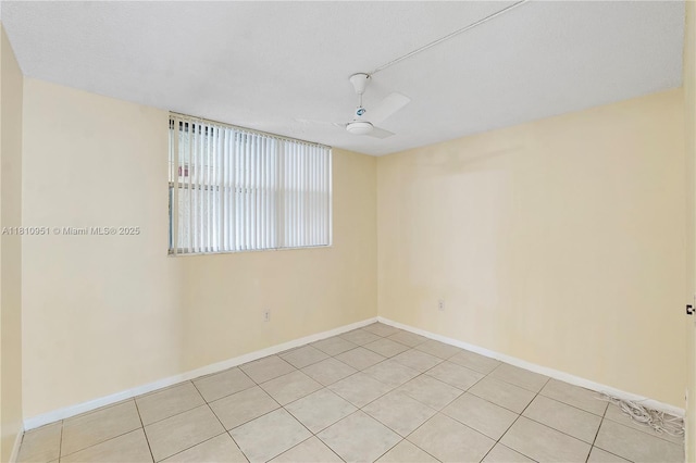 9091 Lime Bay Blvd Unit 110, Tamarac, FL 33321 - spare room with ceiling fan, baseboards, and light tile patterned flooring