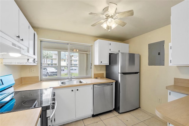 9091 Lime Bay Blvd Unit 110, Tamarac, FL 33321 - kitchen with appliances with stainless steel finishes, electric panel, a sink, white cabinets, and light countertops