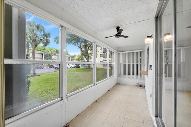 9091 Lime Bay Blvd Unit 110, Tamarac, FL 33321 - unfurnished sunroom featuring ceiling fan and healthy amount of natural light