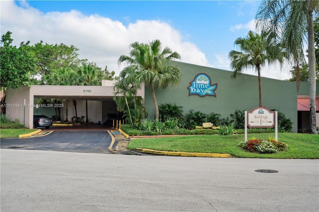 9091 Lime Bay Blvd Unit 110, Tamarac, FL 33321 - view of building exterior featuring driveway