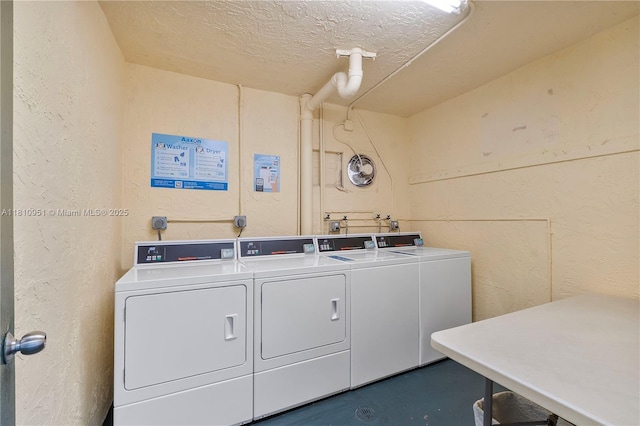 9091 Lime Bay Blvd Unit 110, Tamarac, FL 33321 - community laundry room with separate washer and dryer, a textured wall, and a textured ceiling