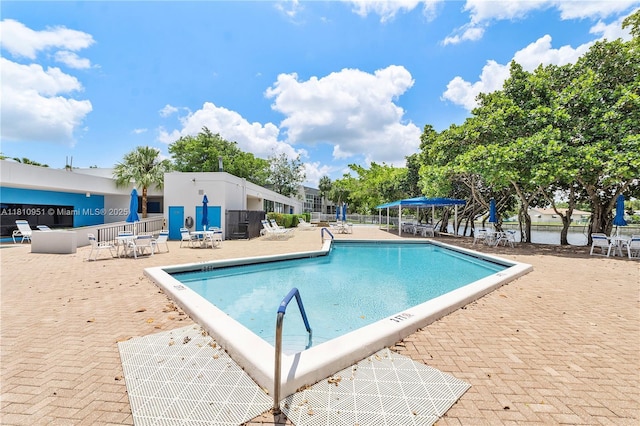 9091 Lime Bay Blvd Unit 110, Tamarac, FL 33321 - community pool with a patio area