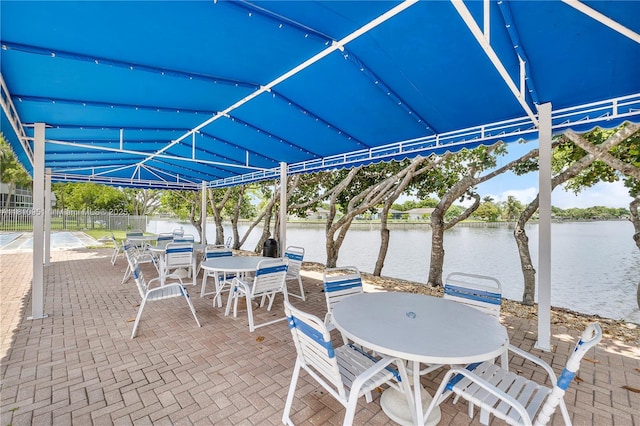 9091 Lime Bay Blvd Unit 110, Tamarac, FL 33321 - view of patio / terrace with outdoor dining space and a water view