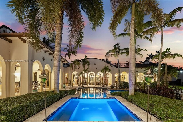 18451 SW 158th St, Miami, FL 33187 - pool at dusk featuring an outdoor pool