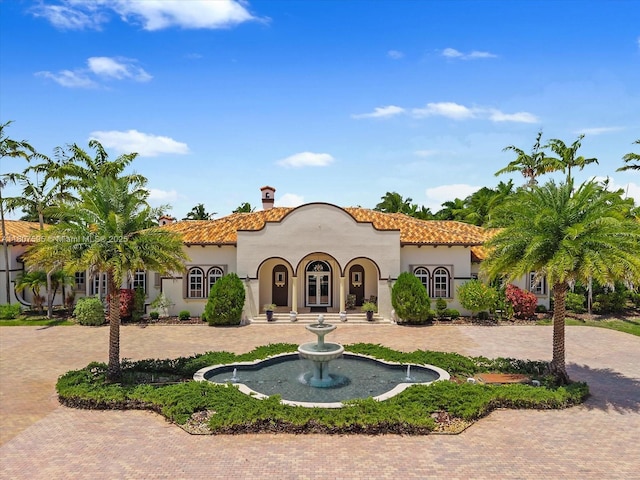 18451 SW 158th St, Miami, FL 33187 - mediterranean / spanish-style house with a tiled roof, stucco siding, a chimney, and french doors