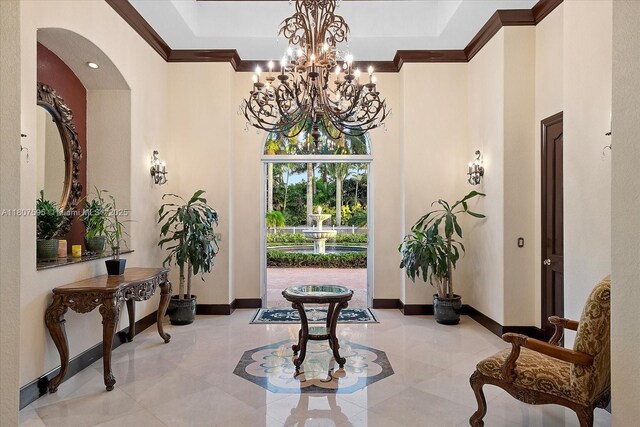 18451 SW 158th St, Miami, FL 33187 - foyer entrance featuring crown molding, a towering ceiling, light tile patterned flooring, baseboards, and arched walkways