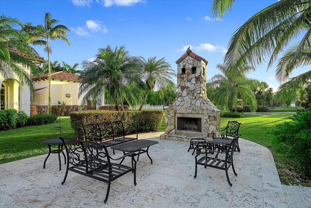 18451 SW 158th St, Miami, FL 33187 - view of patio featuring an outdoor stone fireplace